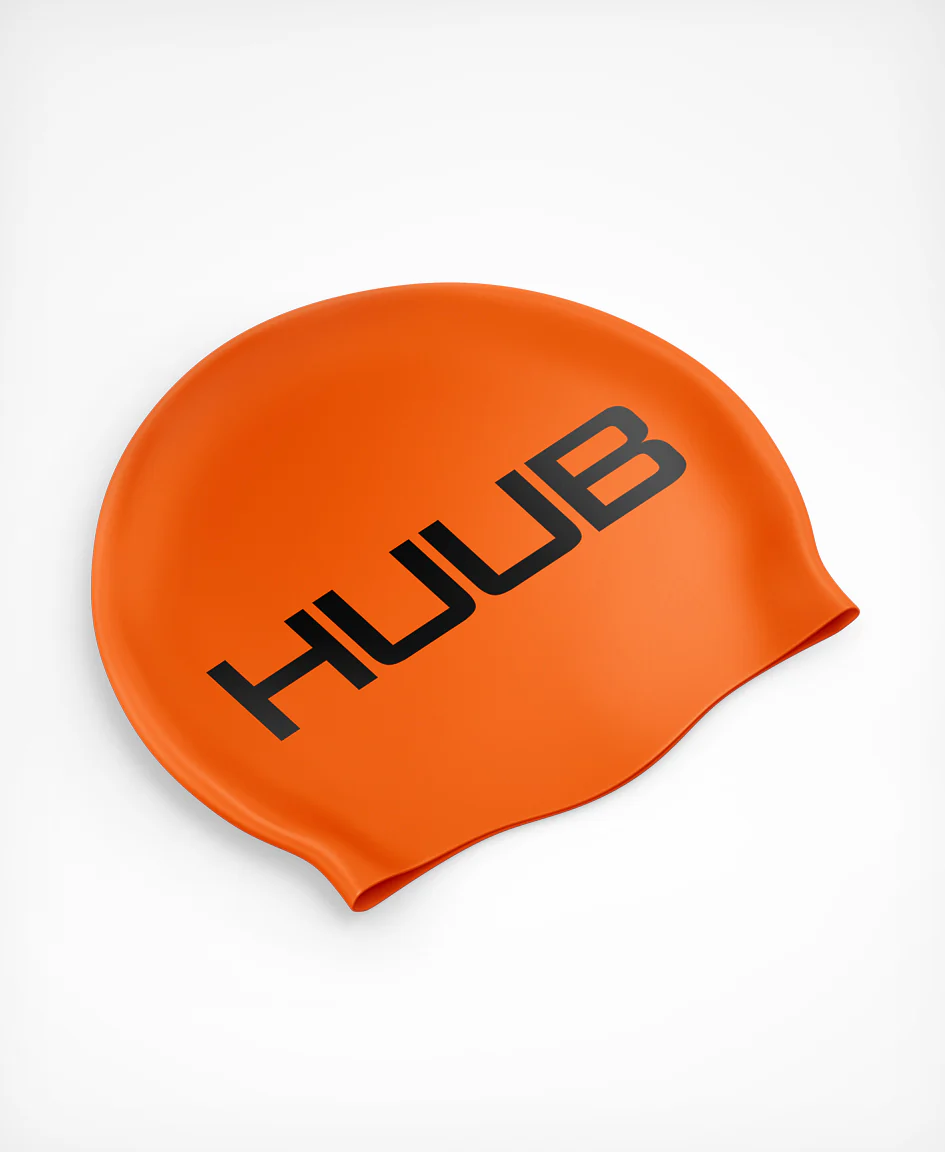 HUUB fluorescent orange silicone swim cap, snug fit, smooth texture, designed for comfortable swimming and visibility.
