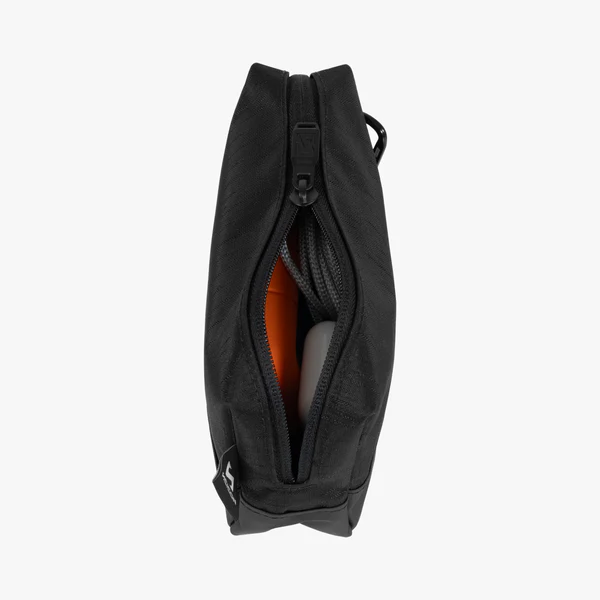 Scicon electronics travel organizer pouch with multiple compartments for cables, chargers, and accessories in black fabric.